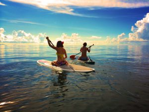 two-women-who-row-a-surfboard